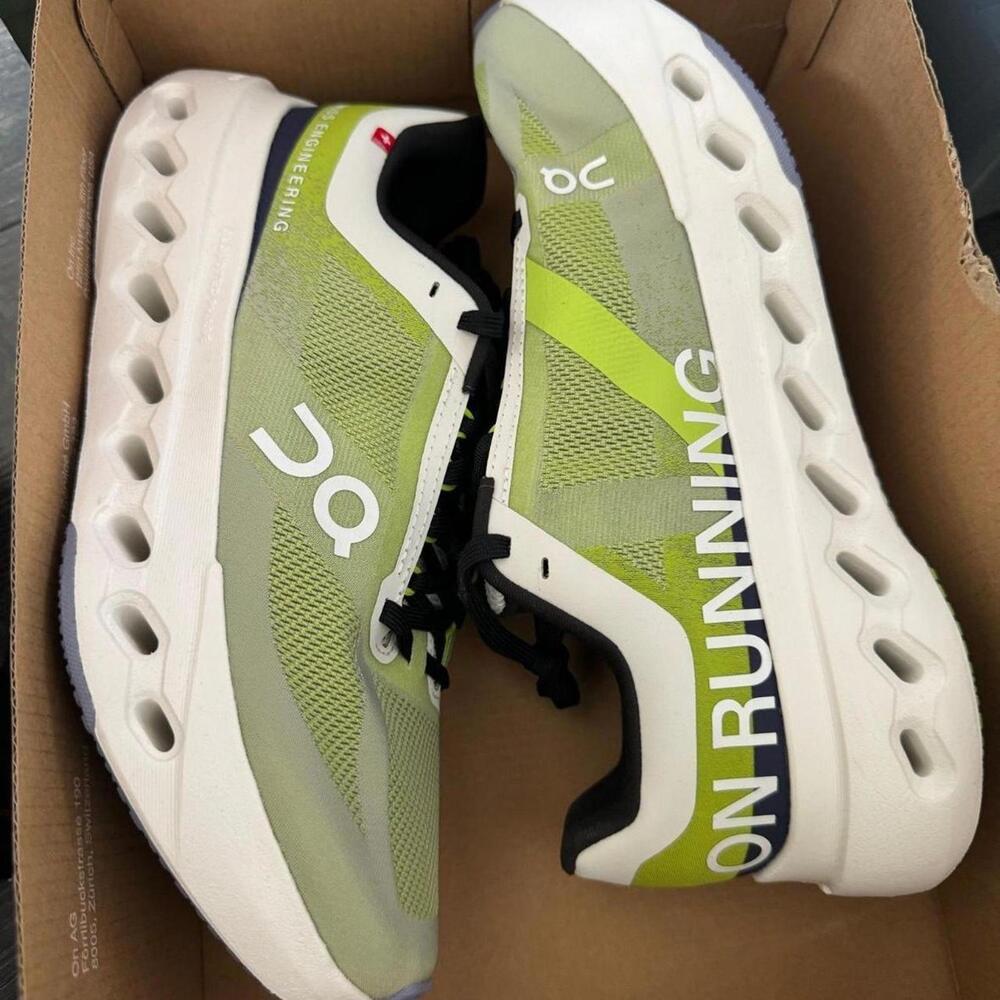 On Running Cloudsurfer Next green and white running shoes